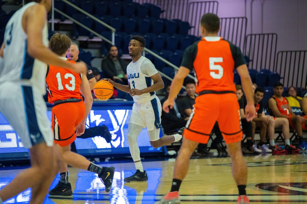 Senior guard Daniel Hornbuckle dribbles up the court as he looks for an opening.