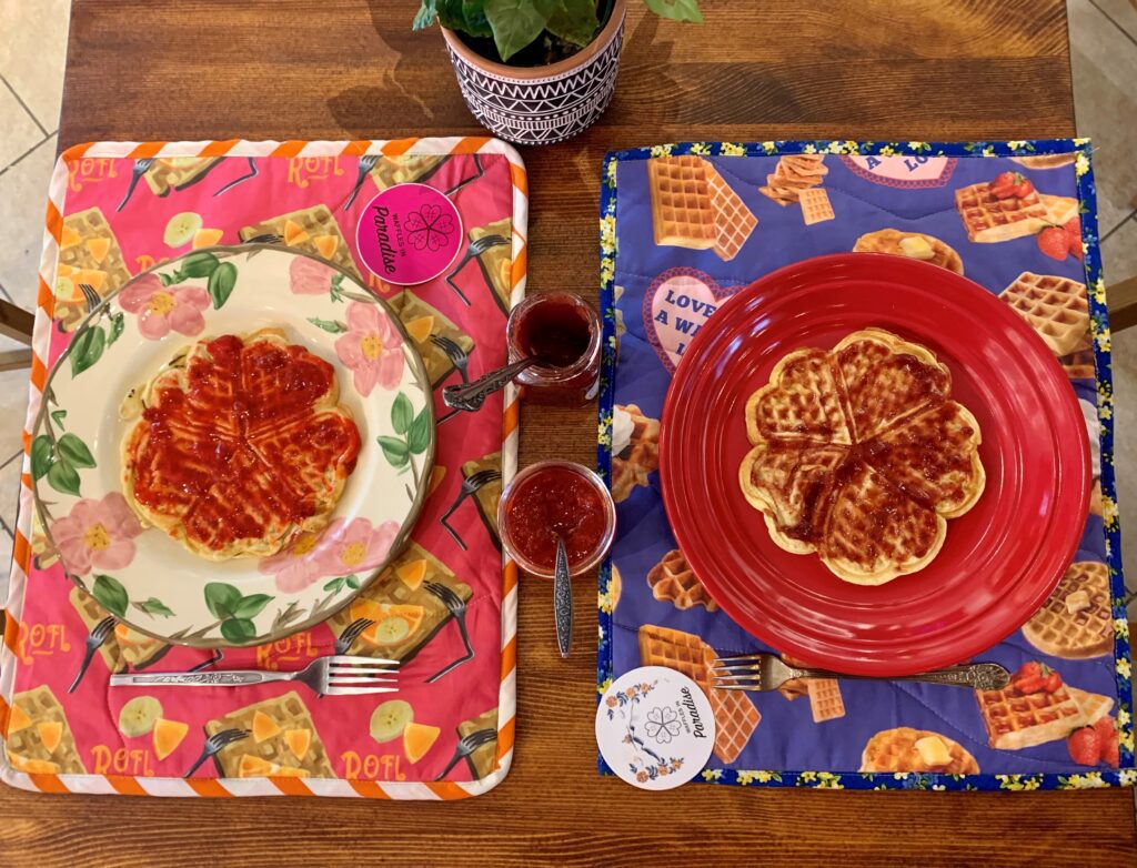 Heart-shaped lefse waffles on bright plates and mats.