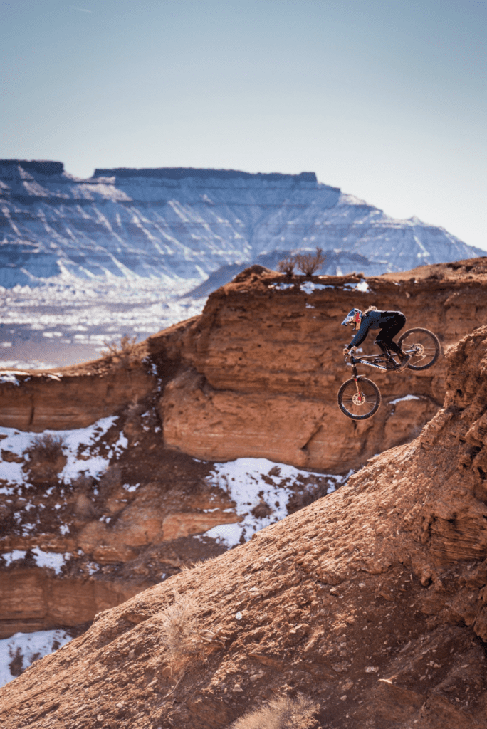 Bellingham resident Hannah Bergemann rides their bike down a dune.