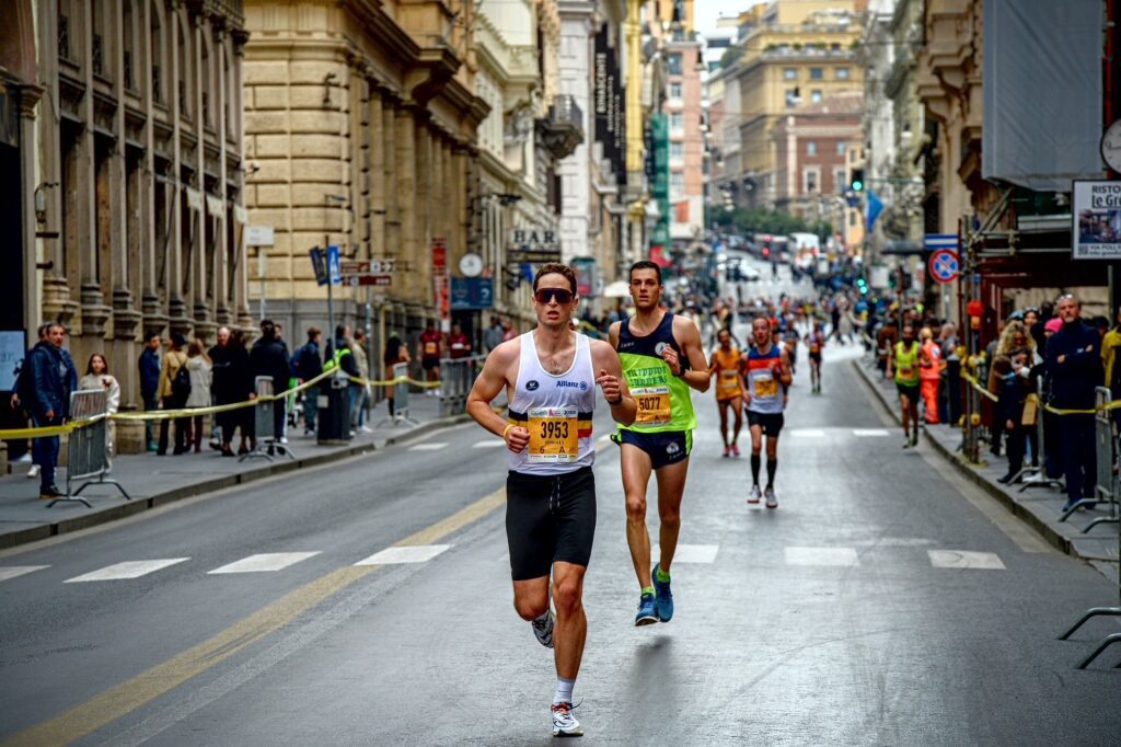 Alexander Kamoen runs through downtown Rome leaving a trail of runners close behind.