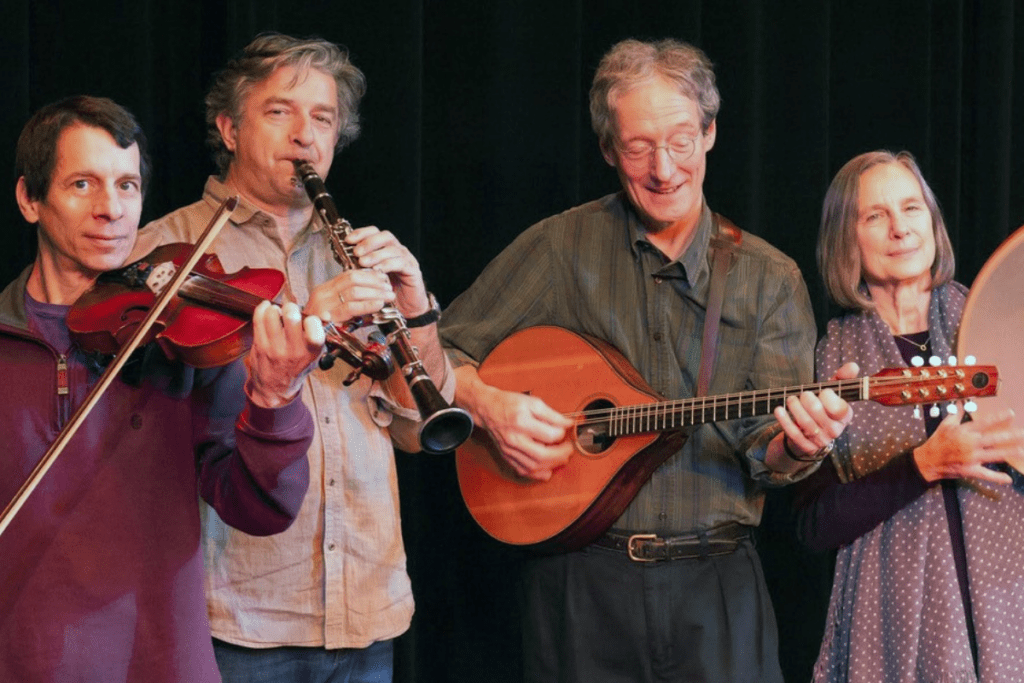 SeaMuse performs on stage with their respective instruments.