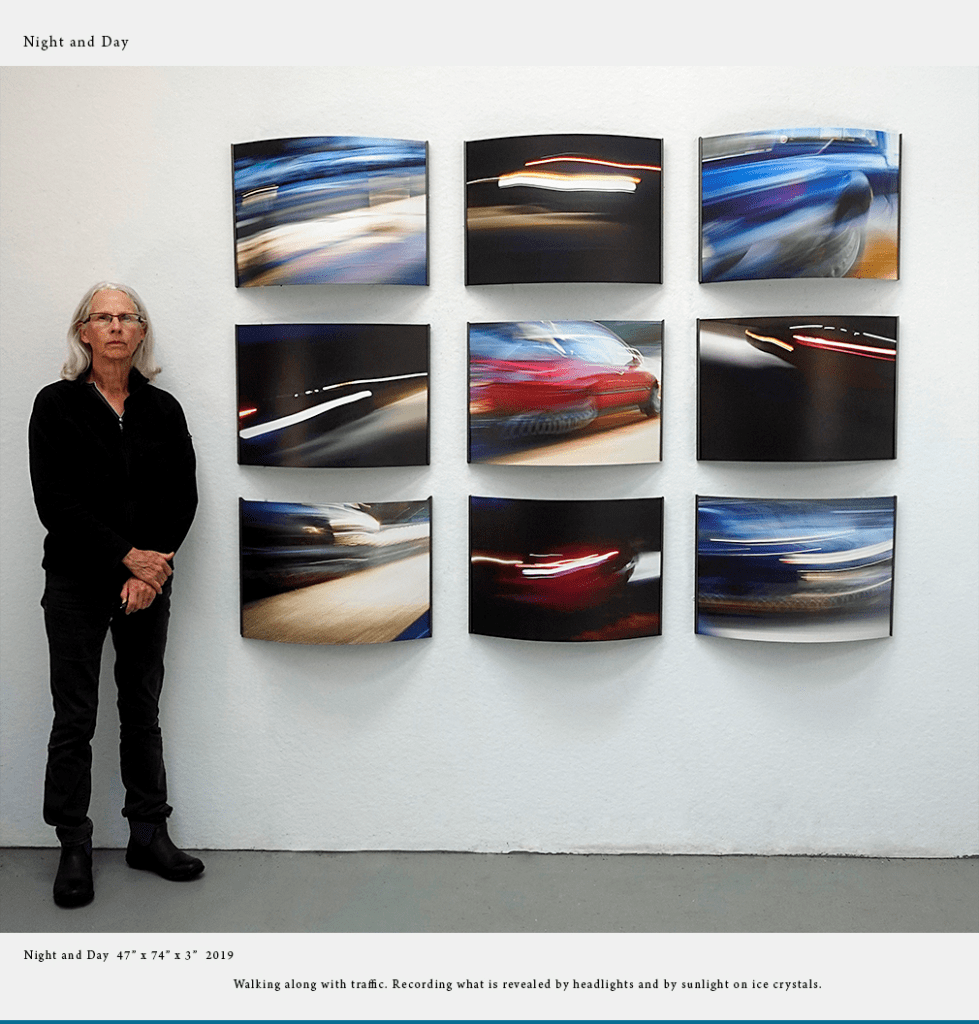 Mixed-media artist RoseAnn Featherston next to her collective work.