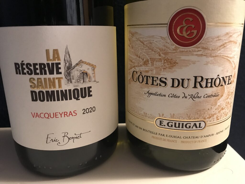 The 2020 Reserve La Saint Dominique Vacqueyras next to another wine.