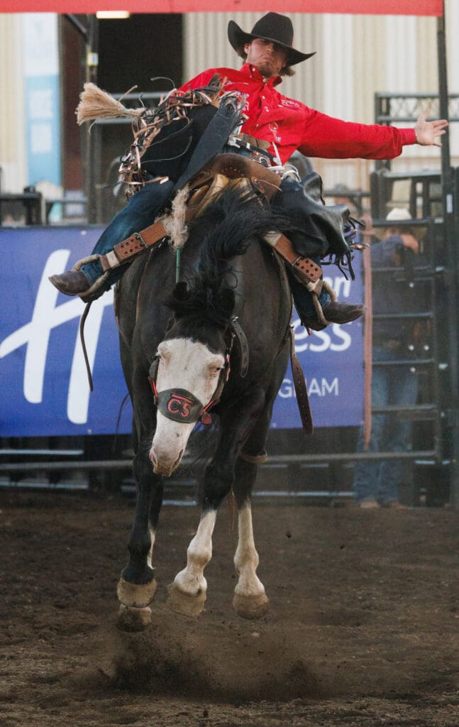 Kade Bruno holds onto a bucking horse.