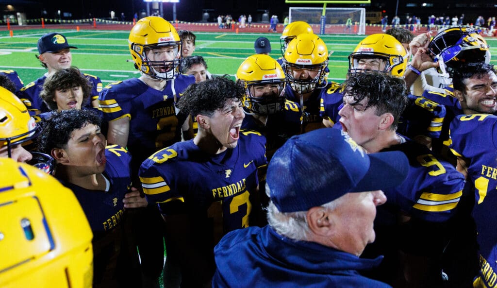 Ferndale’s Bishop Ootsey, center, lets out a yell alongside his teammates who yell and celebrate in the same fashion.