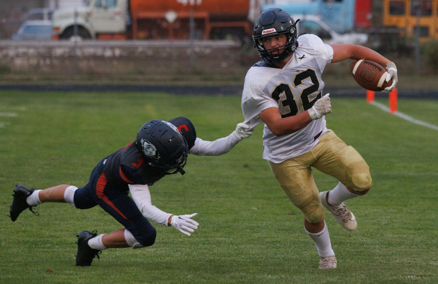 A King’s Way Christian defender tries to stop Meridian’s Landen Downey by grabbing his jersey's sleeve as he falls.