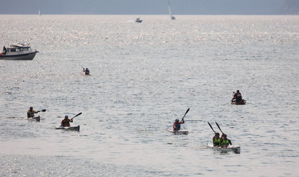 Paddlers complete four laps in Whatcom Creek channel after high winds forced a course change from going into Bellingham Bay.