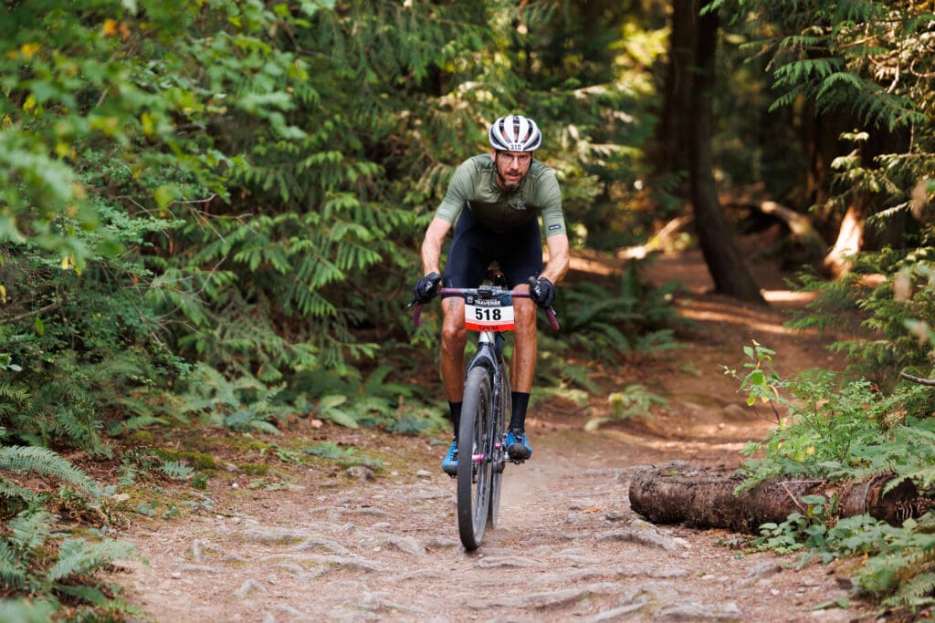 A biker with team Mish Mash keeps his eyes on the path at Lake Padden.