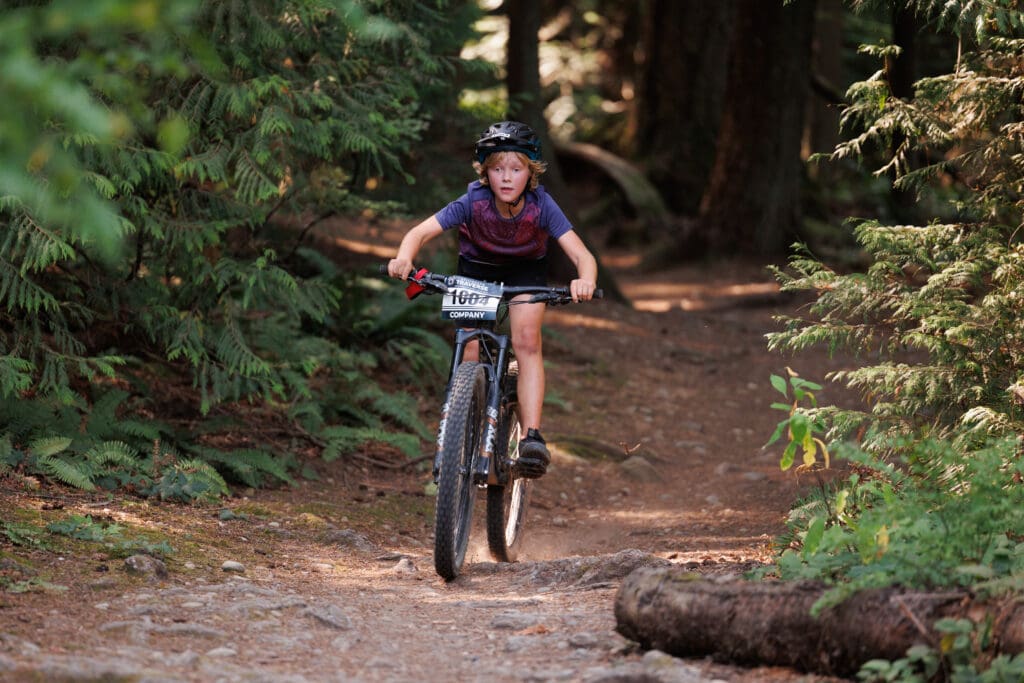 A racer with The Flaming Pickles bikes through the horse trails at Lake Padden. The team, consisting of racers ages 11 to 14, finished 26th of 49 teams.