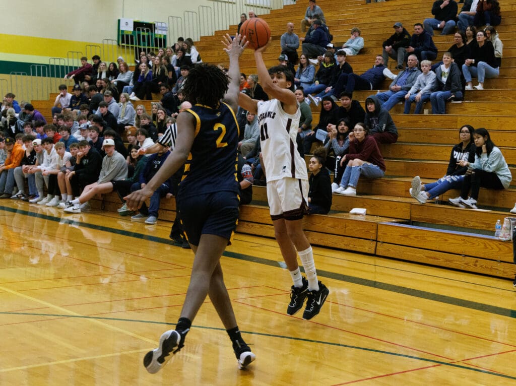 Lummi Nation’s Richard Wilson sinks a 3-point shot.