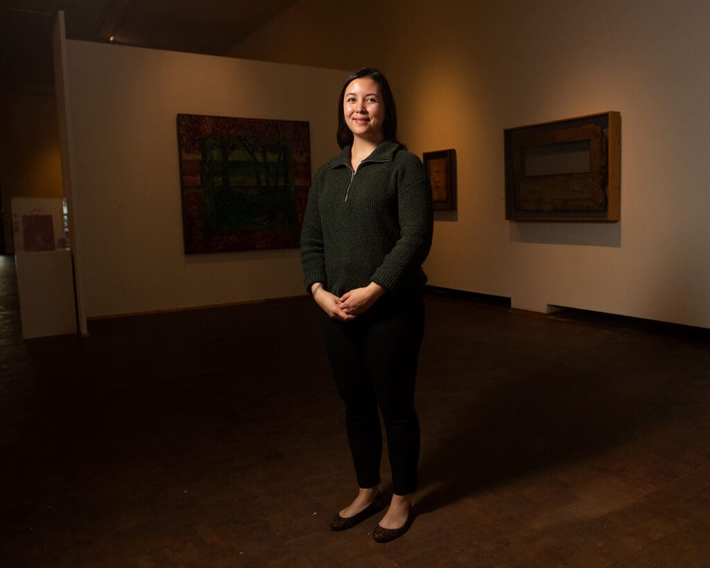 Museum Educator Zoë Fejeran stands in an alcove at Western Gallery.