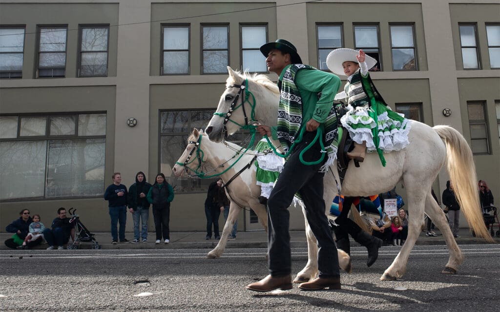 Antonio Florentino and Diana Florentino of the Skagit Latin Horse Association participate in the St. Patrick's Parade on March 11. 2023, in Bellingham.