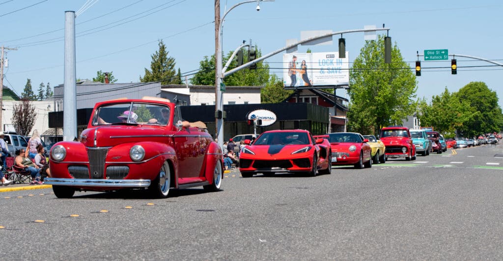 Classic and not-so-old cars roll down Cornwall Avenue.