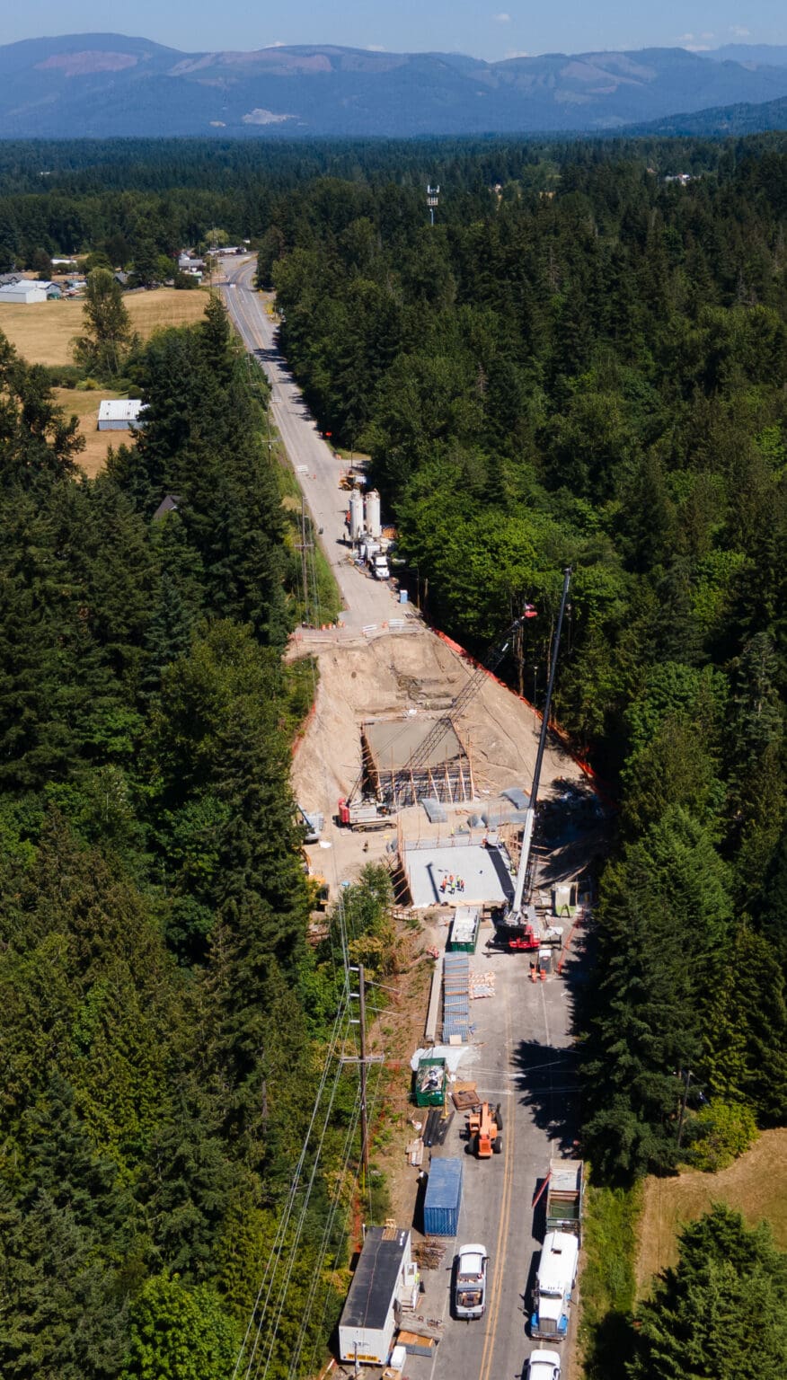 Mount Baker Highway that is currently under construction but surrounded by trees.