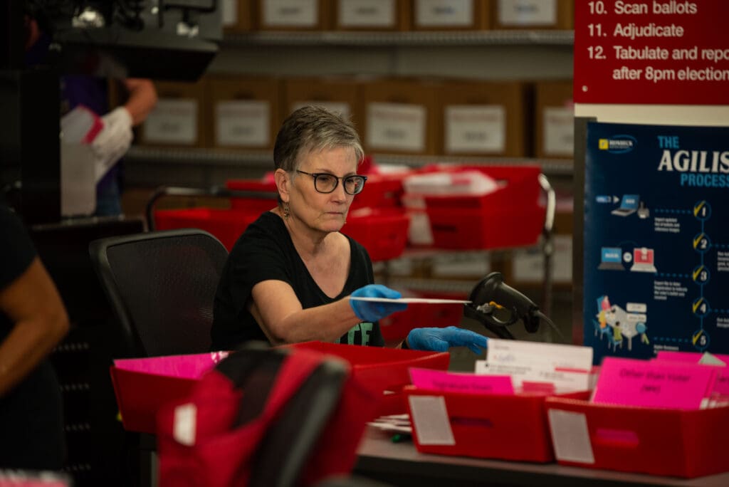 Whatcom County Auditor Diana Bradrick sorts ballots on primary election night.