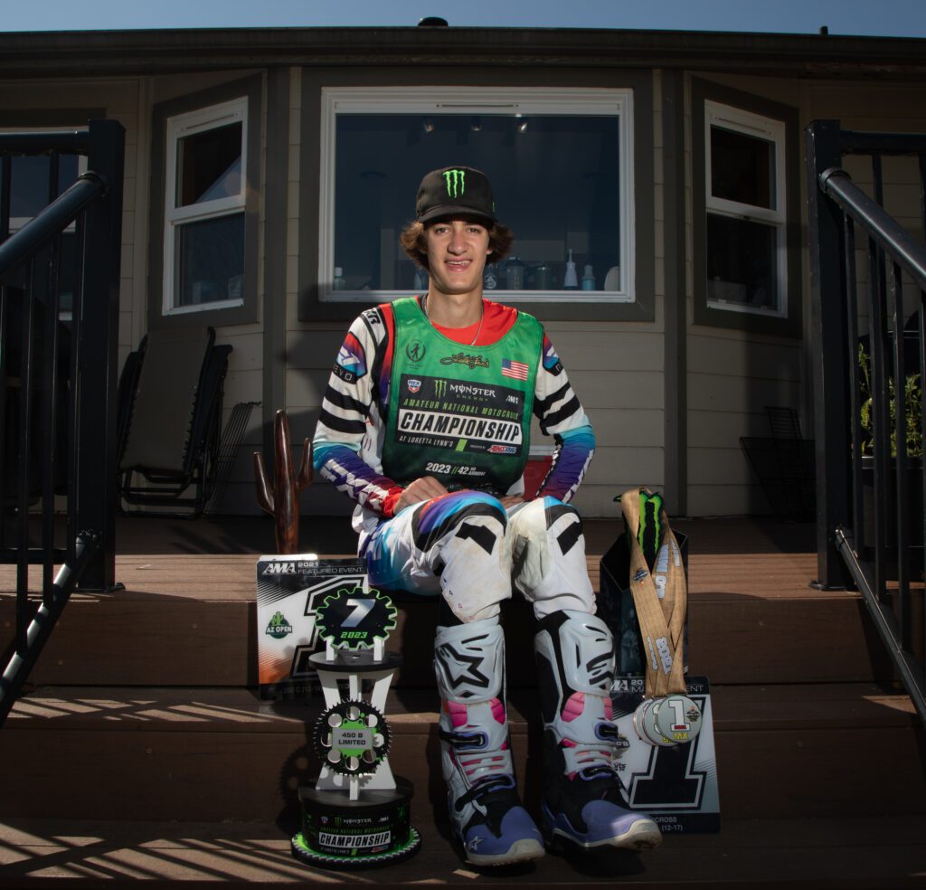 Jacob "JJ" Concannon sits on the deck of his Whatcom County home with medals and trophies beside him.