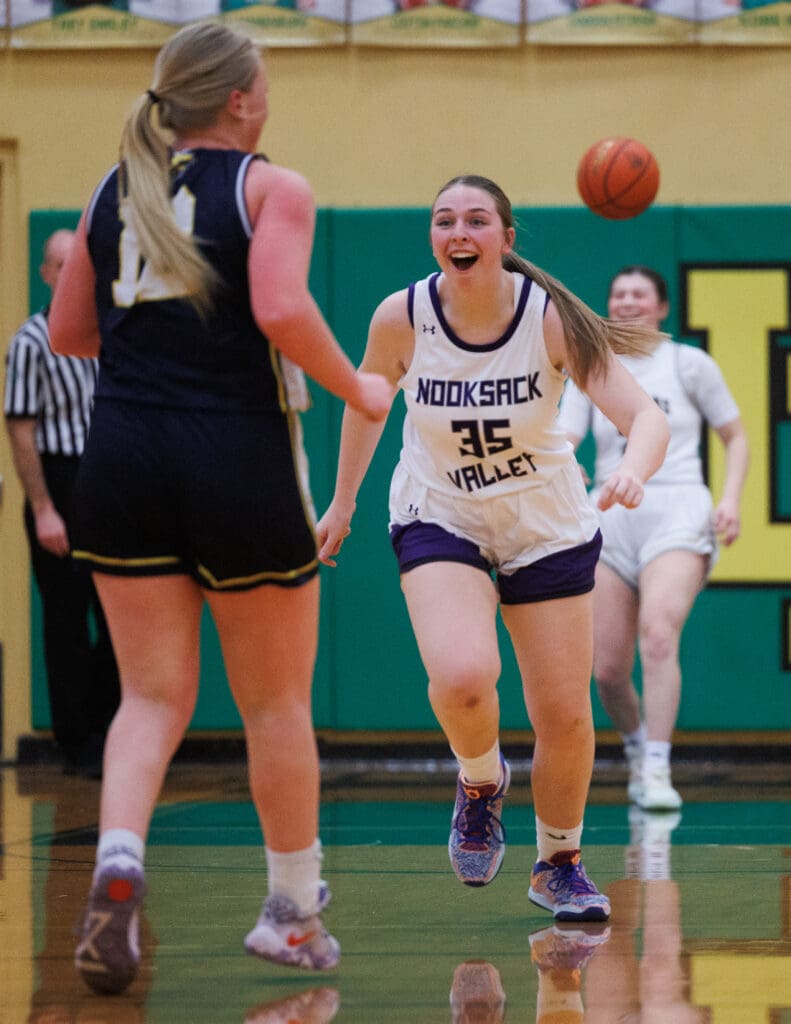 Nooksack Valley’s Ella Perry reacts happily after a player makes a half-court basket.