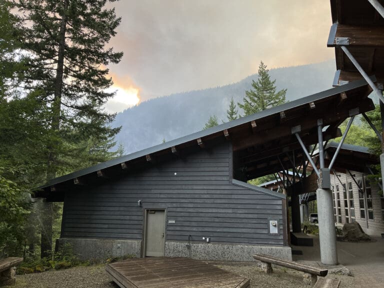 The North Cascades Institute's Environmental Learning Center campus has a slanted roof with the foggy background.