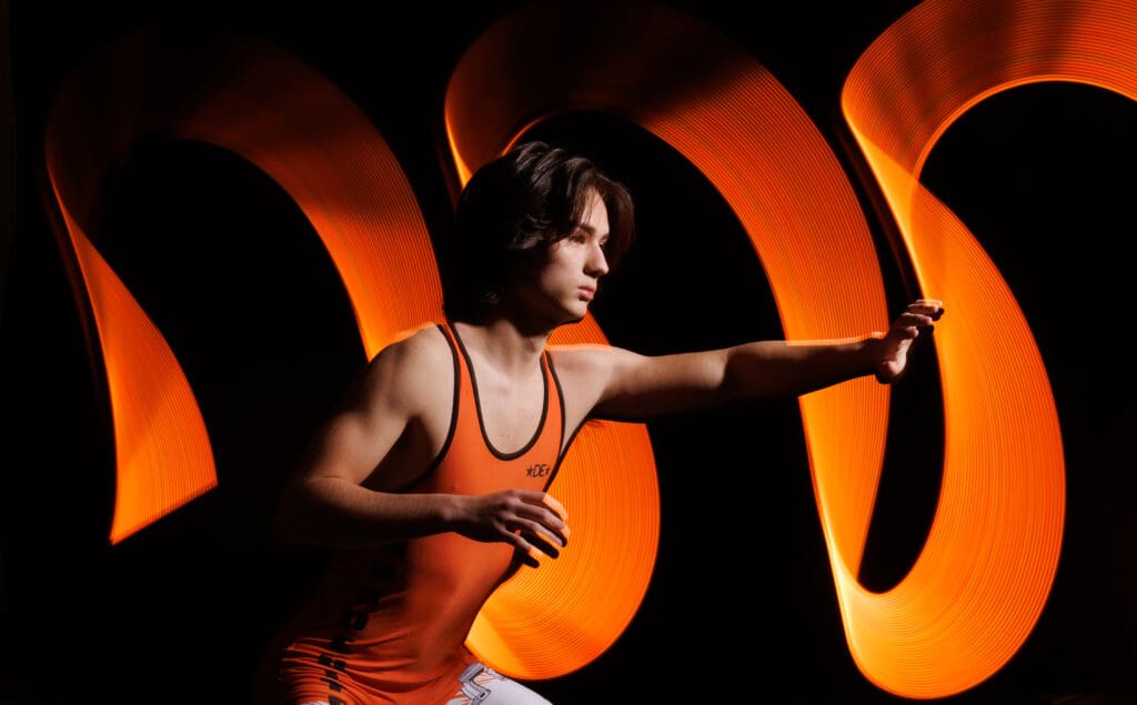 Blaine wrestler Timothy Pomeroy extends their left arm.