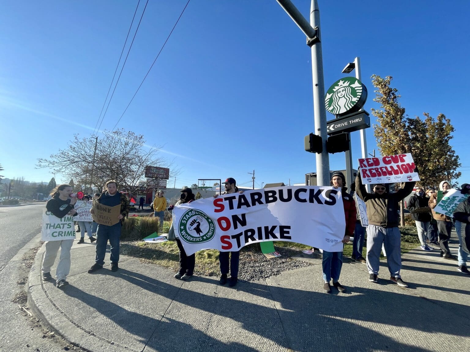 Employees from three separate Bellingham Starbucks locations gathered at the Iowa & King drive-thru location with signs and banners supporting their strikes.