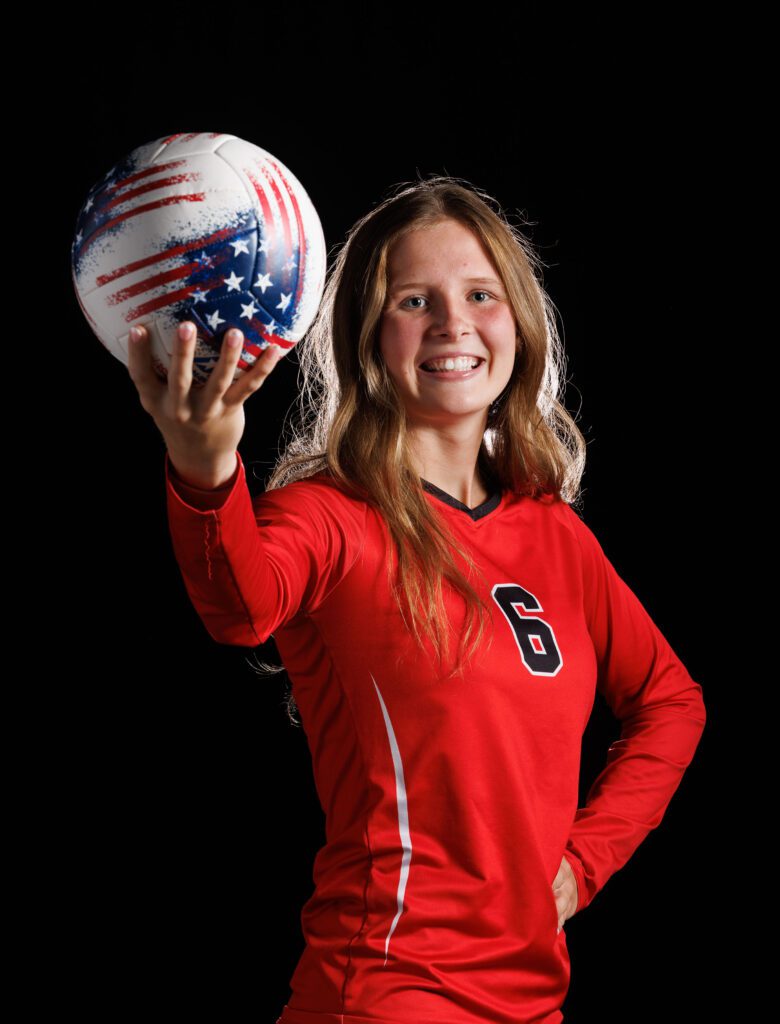 Mount Baker volleyball middle blocker Natalie Horsmon holds up the ball.