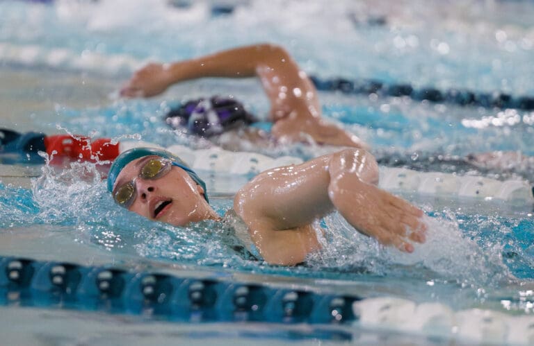 Sehome’s Mara Brogan swims and breaches for water to the side for air.