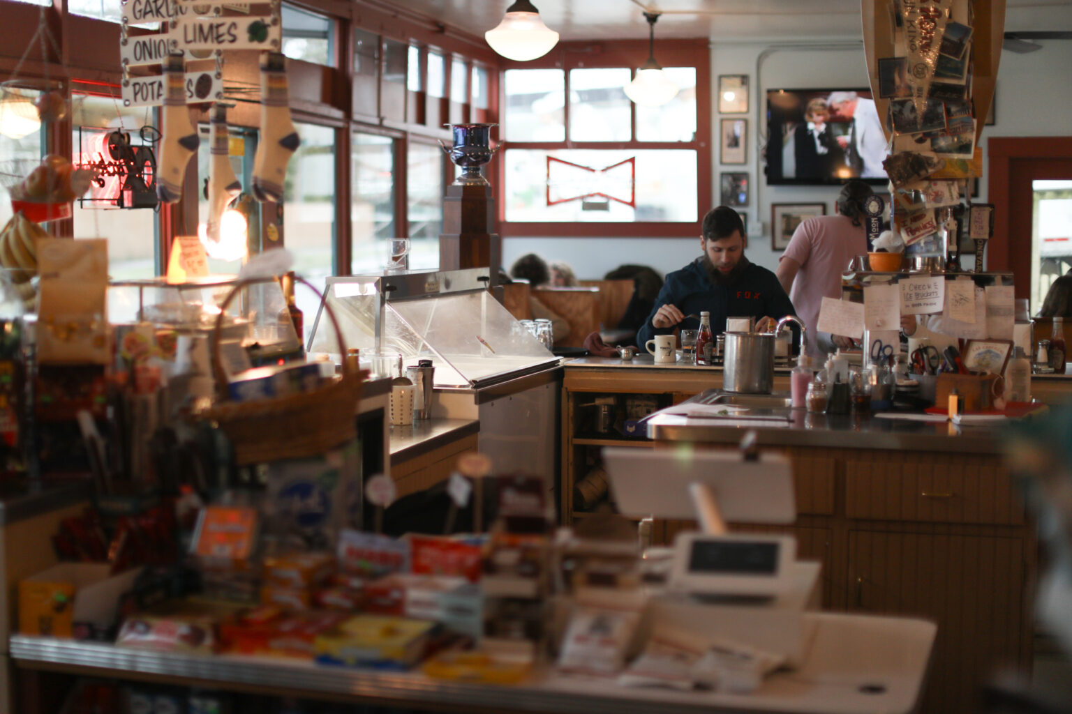 Nelson's Market customers enjoy their breakfasts at the bar seats and booths.