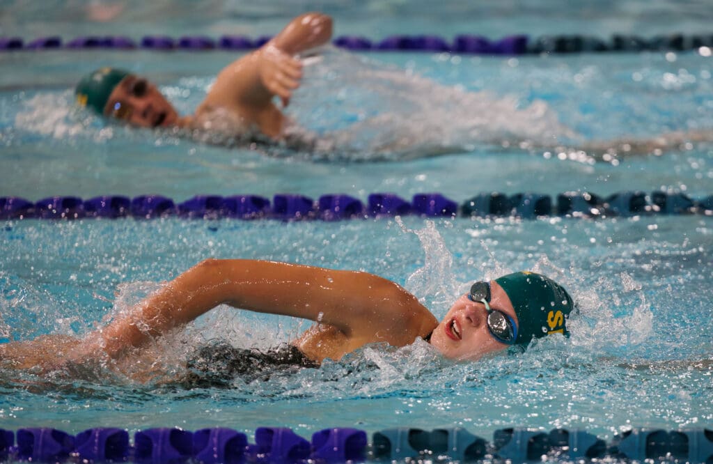 Sehome’s Elsa Ethelbah laps a swimmer on the other side as she turns to breathe.