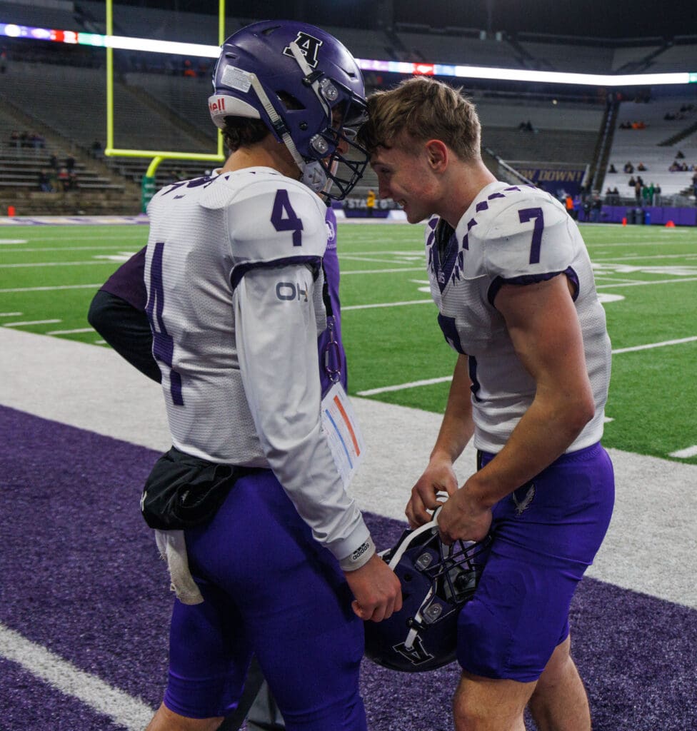 Anacortes quarterback Rex Larson and wideout Rylin Lang head-bump each other as the clock winds down and the Seahawks secure the win.