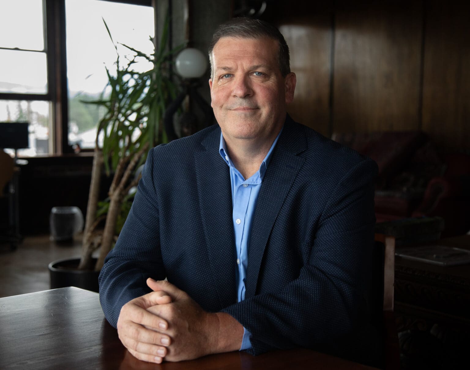 Whatcom County Sheriff's Office Undersheriff Doug Chadwick sitting at a desk with his hands together.