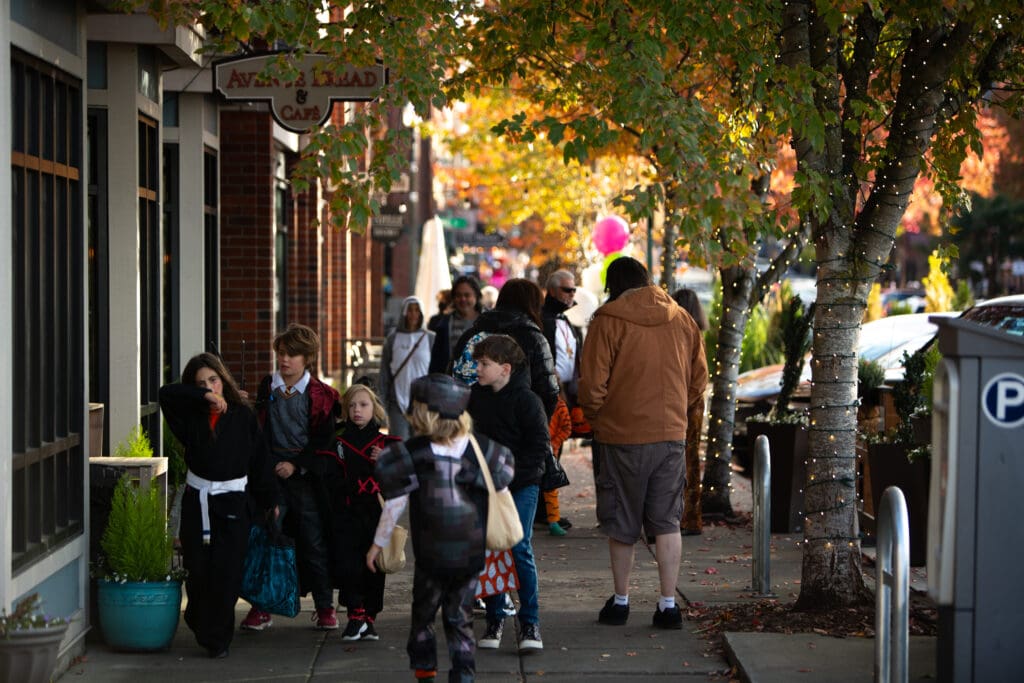 Trick-or-treaters roaming the streets with their bags of candy, costumes and adult escorts.