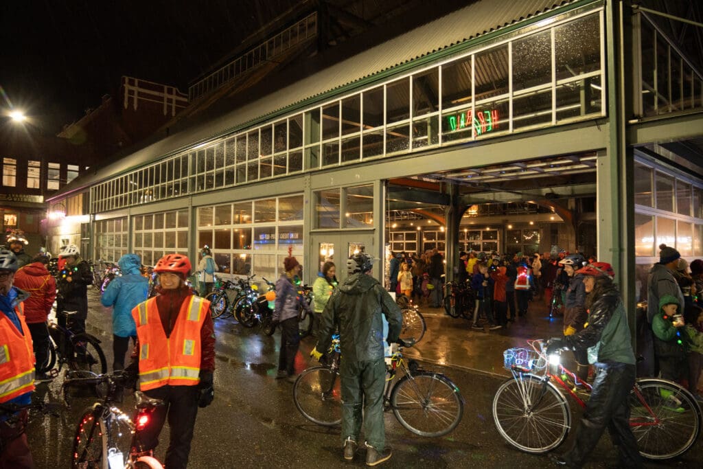 Bikers reconvene at Depot Market Square where its full of cyclers and children.