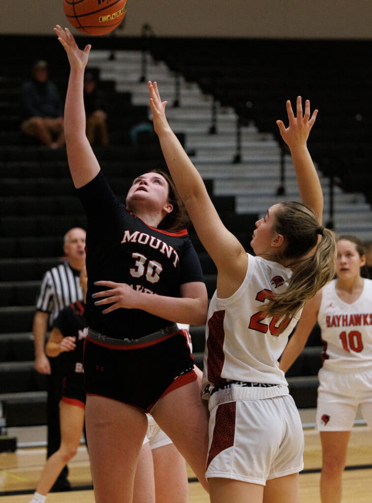 Mount Baker’s Jenna Wineinger shoots a layup agsint Bellingham’s Mary Lockett.