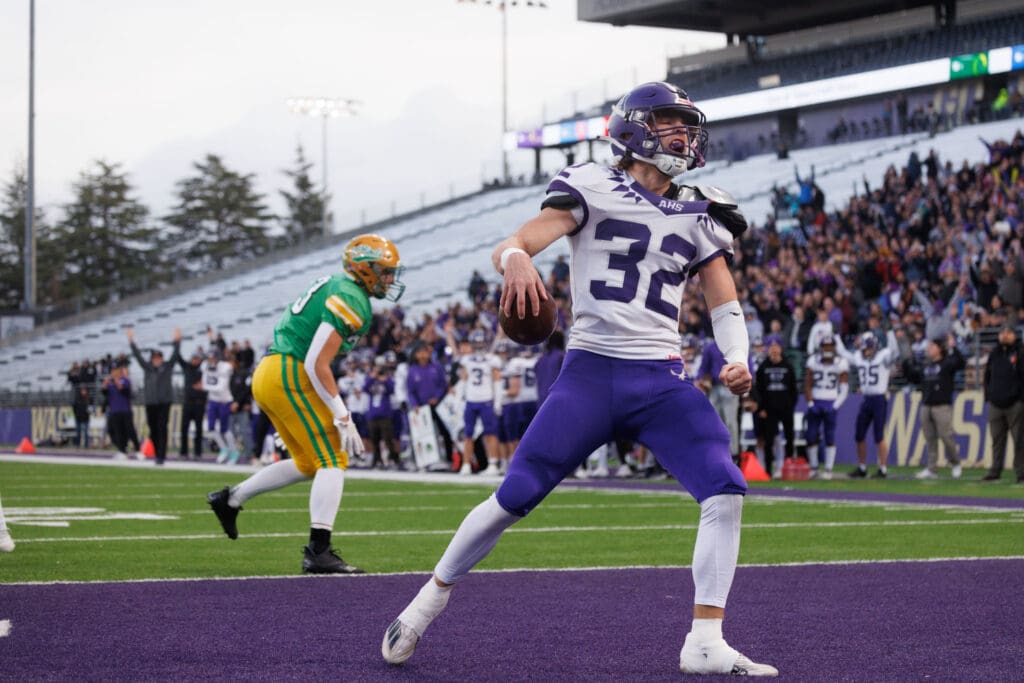 Anacortes running back Brock Beaner yells after scoring a touchdown.