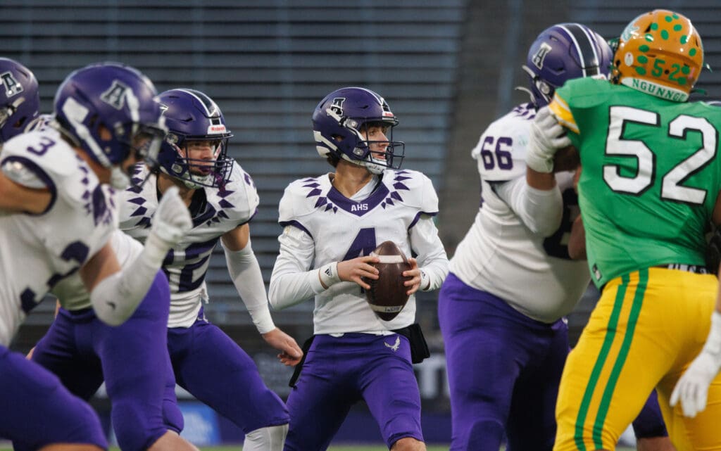 Anacortes quarterback Rex Larson looks for an open receiver.