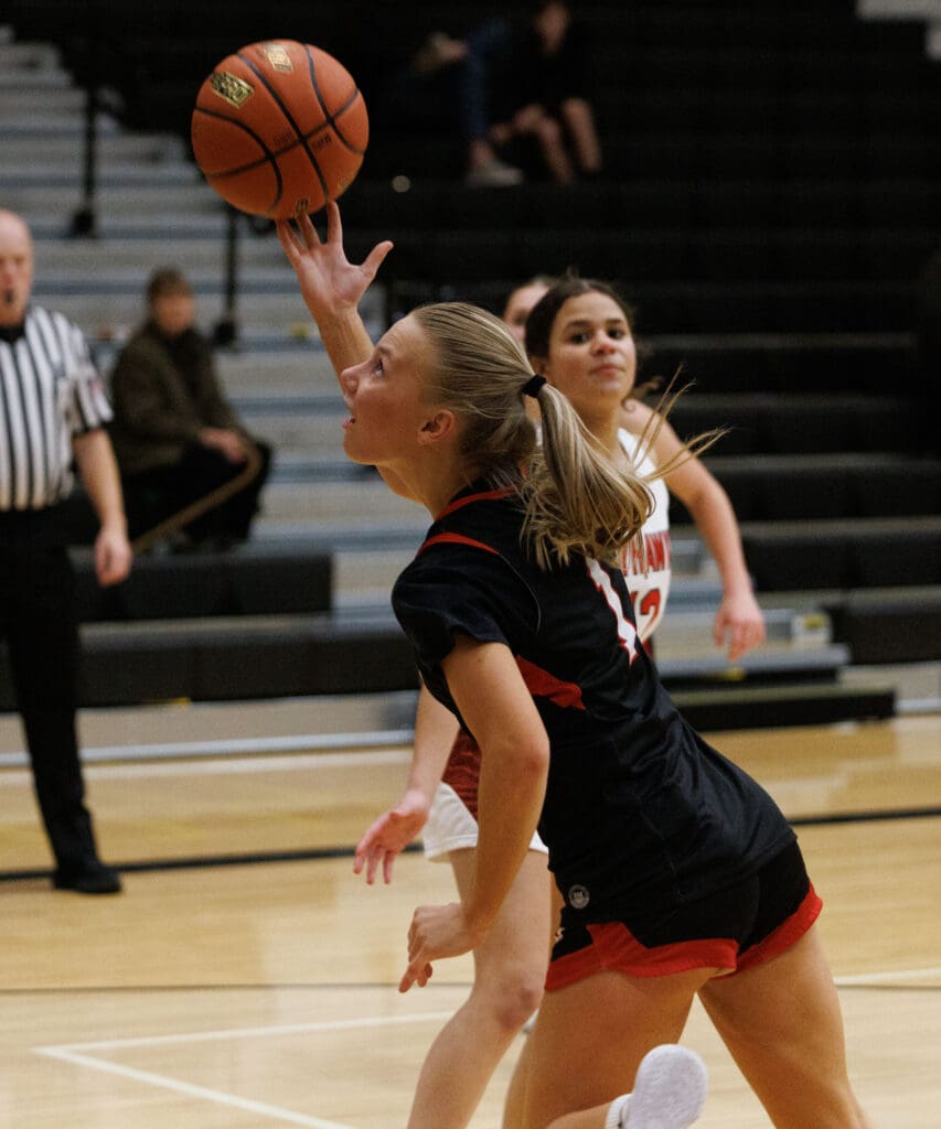 Mount Baker’s Natalie Van Liew hits a basket while being tripped in Wednesday’s game against Mount Baker.