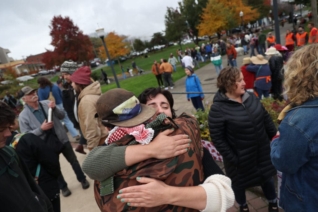 After the rally, families hug and chat.