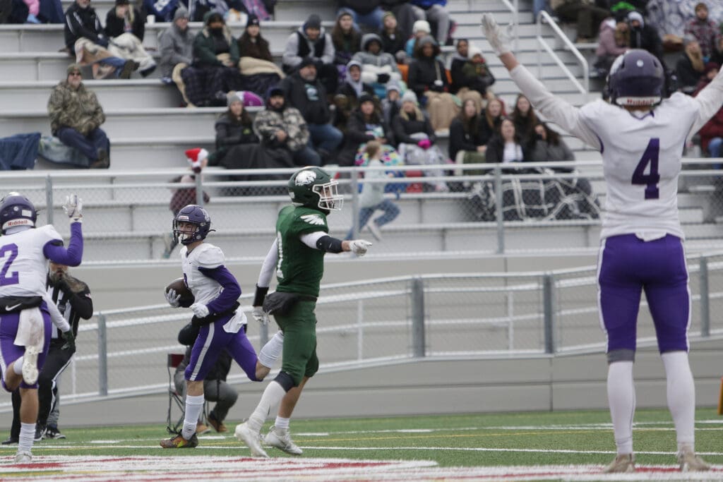 Nooksack Valley’s Cory Olney runs for a touchdown as Cole Bauman (4) gives the touchdown signal.