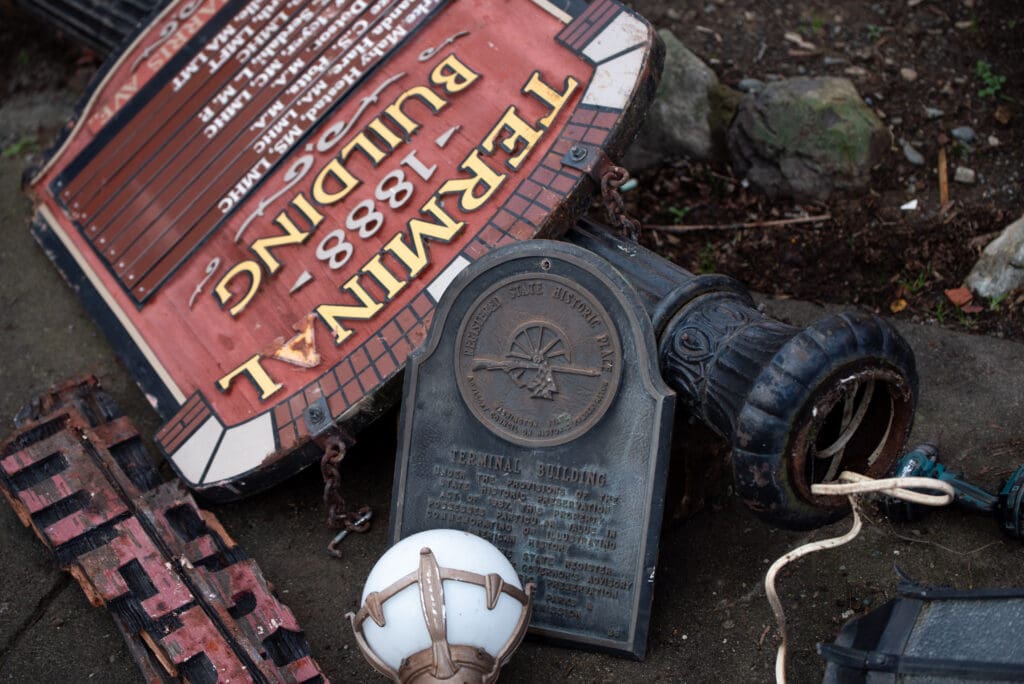 Salvaged exterior ornaments from the Terminal Building sit in a pile away from the wreckage.