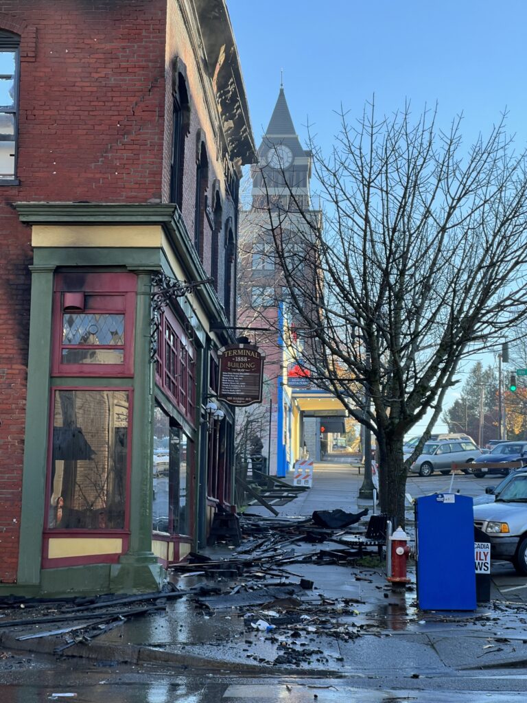 Damaged pieces of the historic Terminal Building litter the sidewalk along Harris Avenue.