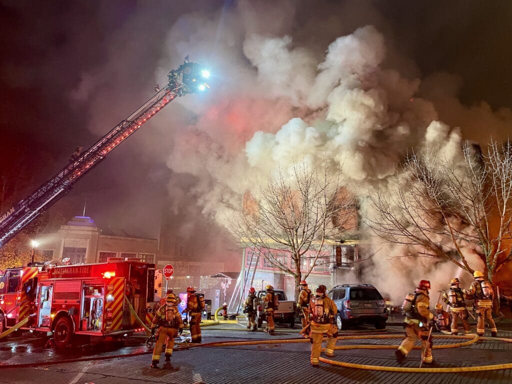 Ladder trucks on 11th Street fight a fire from above the Terminal Building in Fairhaven Saturday night