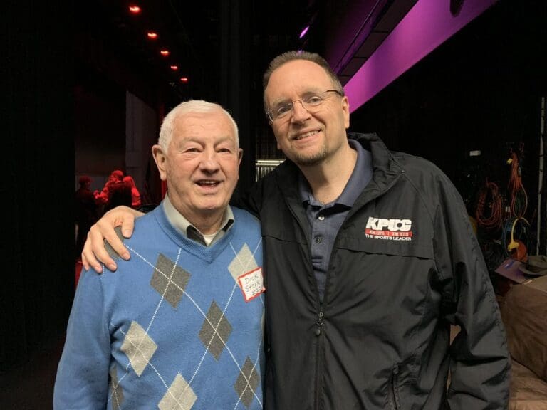 Mark Scholten, right, and Dick Stark, left, smiles for the camera with his arm around him.