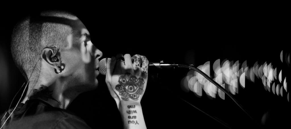 Trevor Powers of Youth Lagoon sings into the mic.