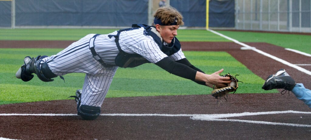 Squalicum catcher Hayden Hollingsworth misses the tag on Ferndale’s Andrew James.