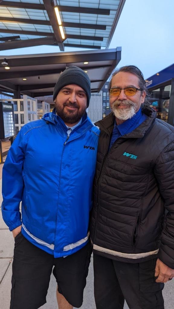 Matt James, left, posing for the photo with his dad Jeff, right at the bus station.