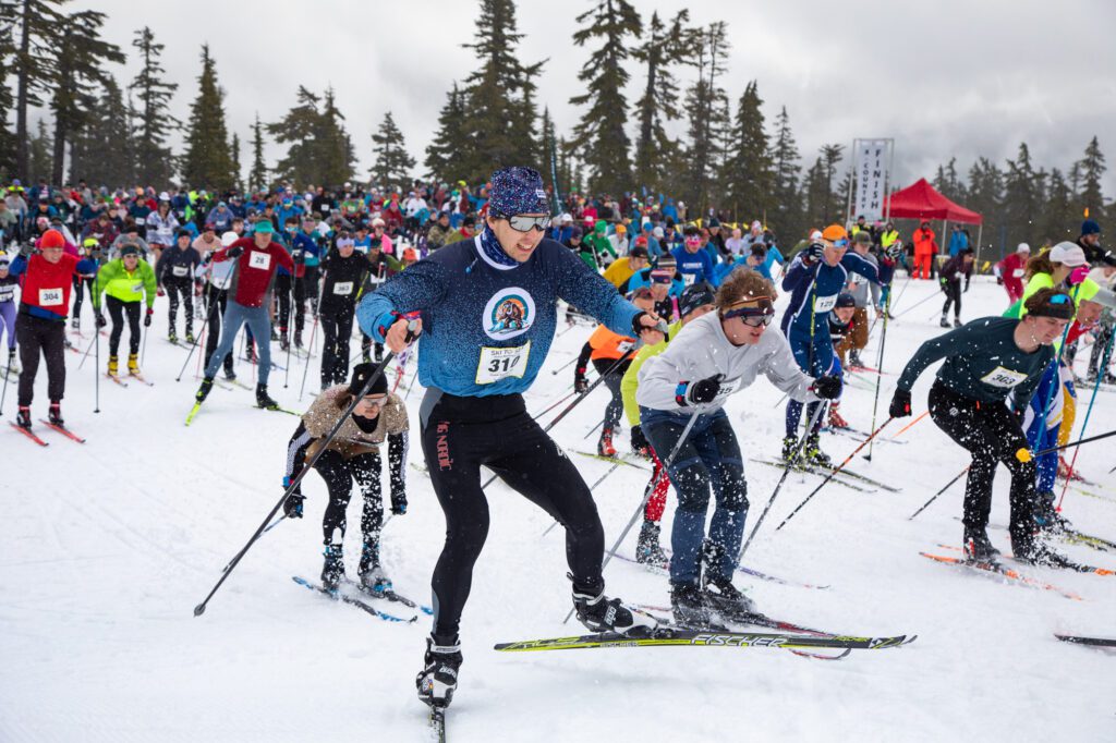 Greg Karabinos of Prima Mastodonnas launches up the first hill of the cross-country ski leg.