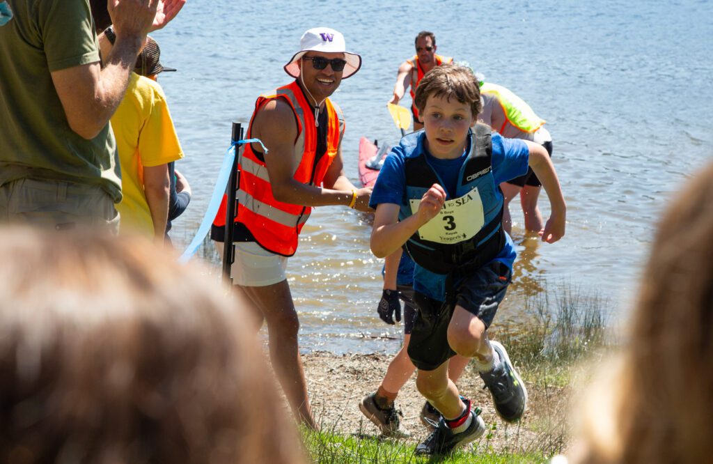 Blaise Fredette of the B Boyz sprints for the finish Saturday, May 11 after completing the kayak leg of Junior Ski to Sea at Lake Padden. The B Boyz finished third in the elementary school male division.