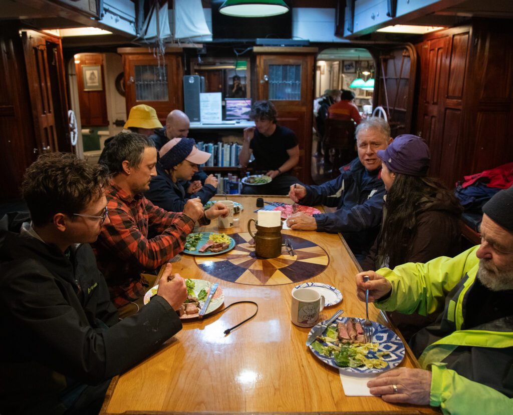 Crew and passengers feast on steak and salad in the main salon of the Zodiac. The ship was designed to "combine 1920's-style elegance with modern comforts."