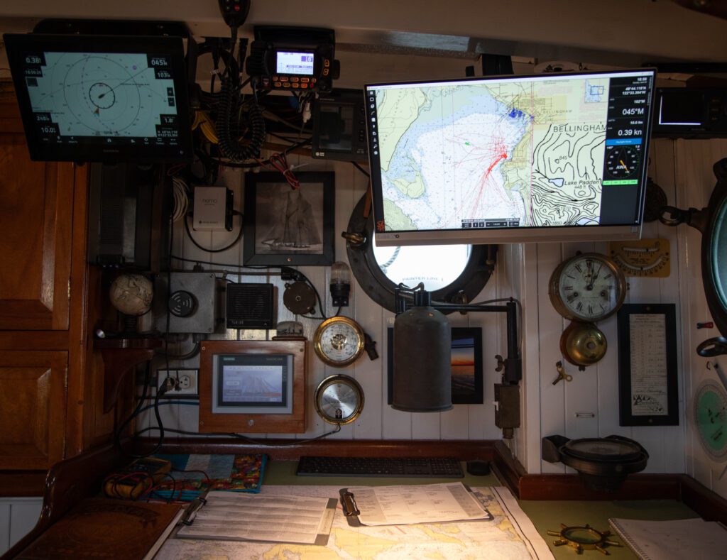 Old fashioned instruments and charts are used alongside computers.