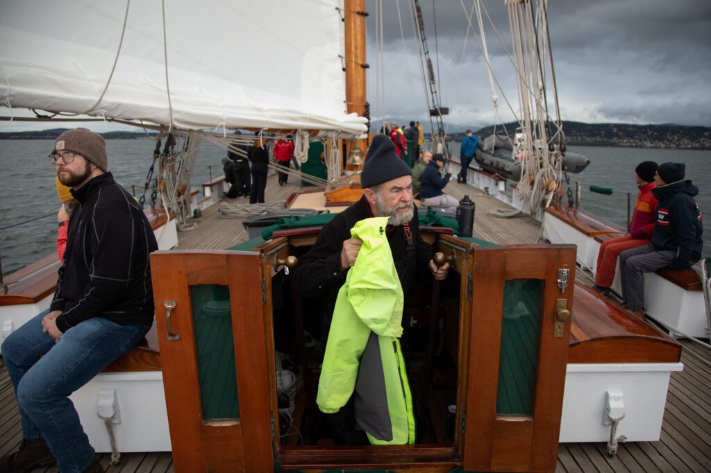 Volunteer crew member Dave Gell ascends from the ship's main salon.